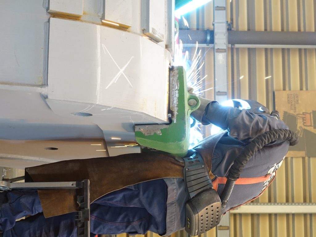 Welder working on a mining bucket