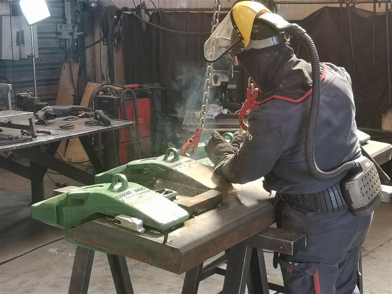 An Haladjian mining welding expert working on a mining conversion program